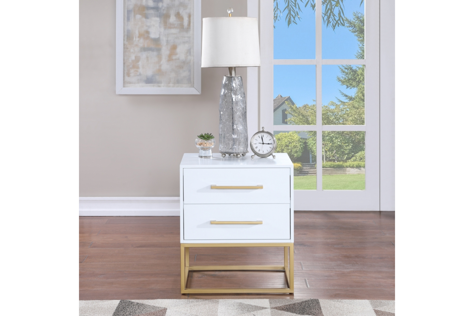 white nightstand with gold finishes
