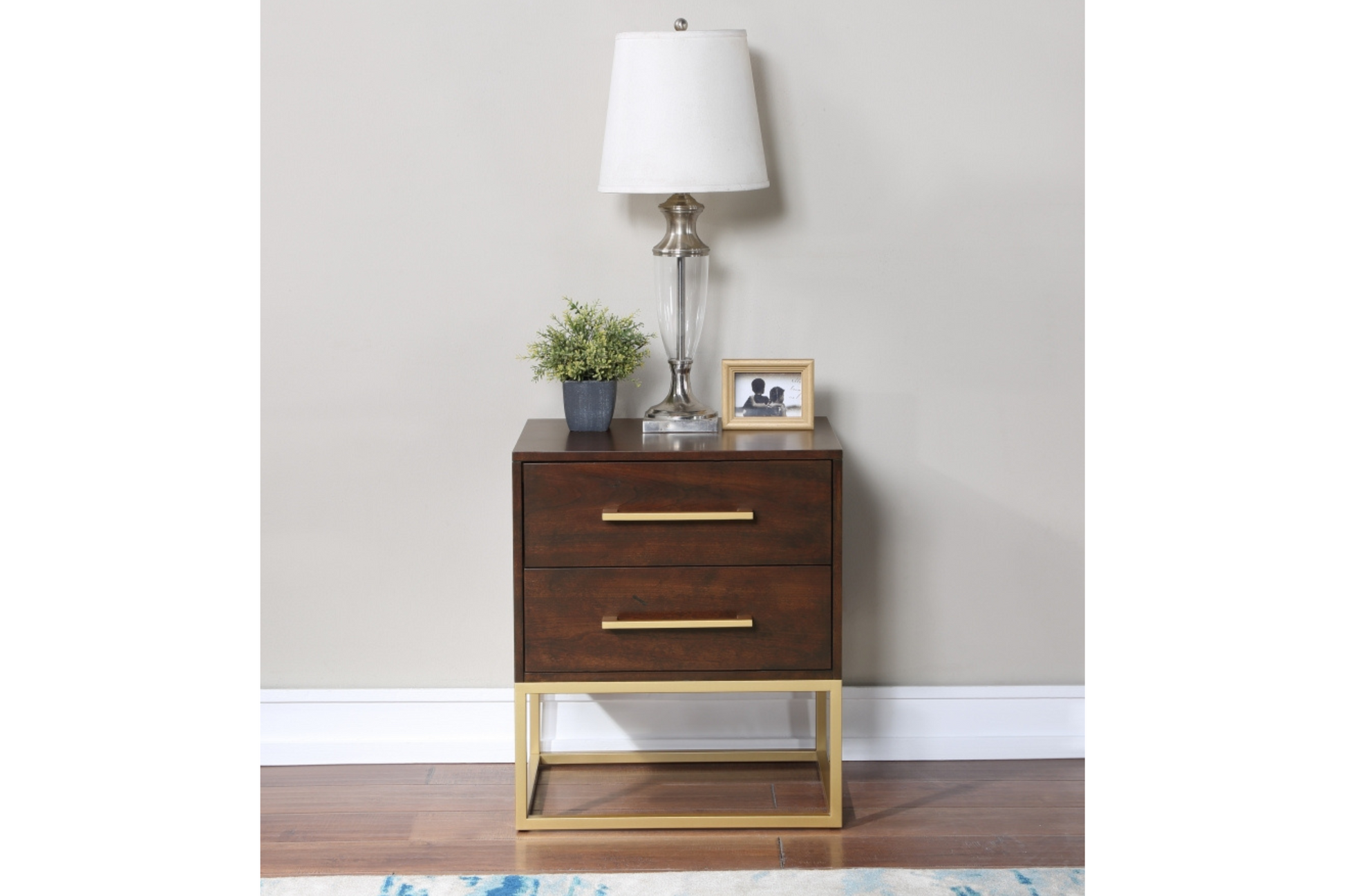 white nightstand with gold finishes